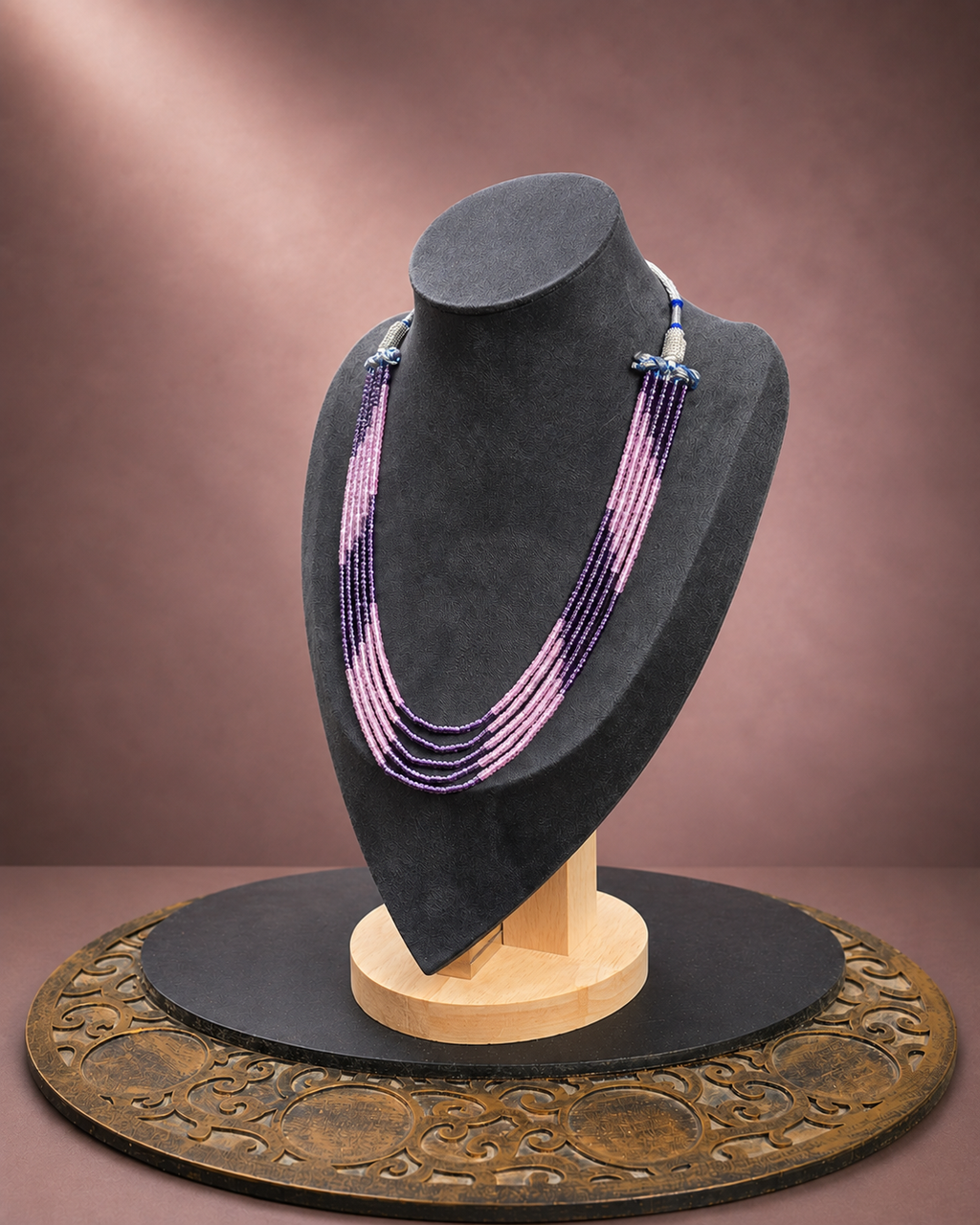 Blush and plum multi-strand beaded necklace shown from the opposite side angle