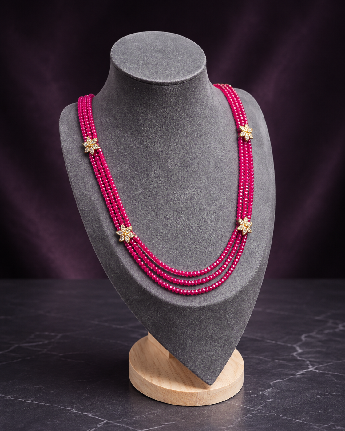 Fuchsia multi-strand floral beaded necklace left angle view
