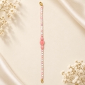 Blush pink and ivory beaded bracelet with carved floral centre and gold-tone clasp – full product view